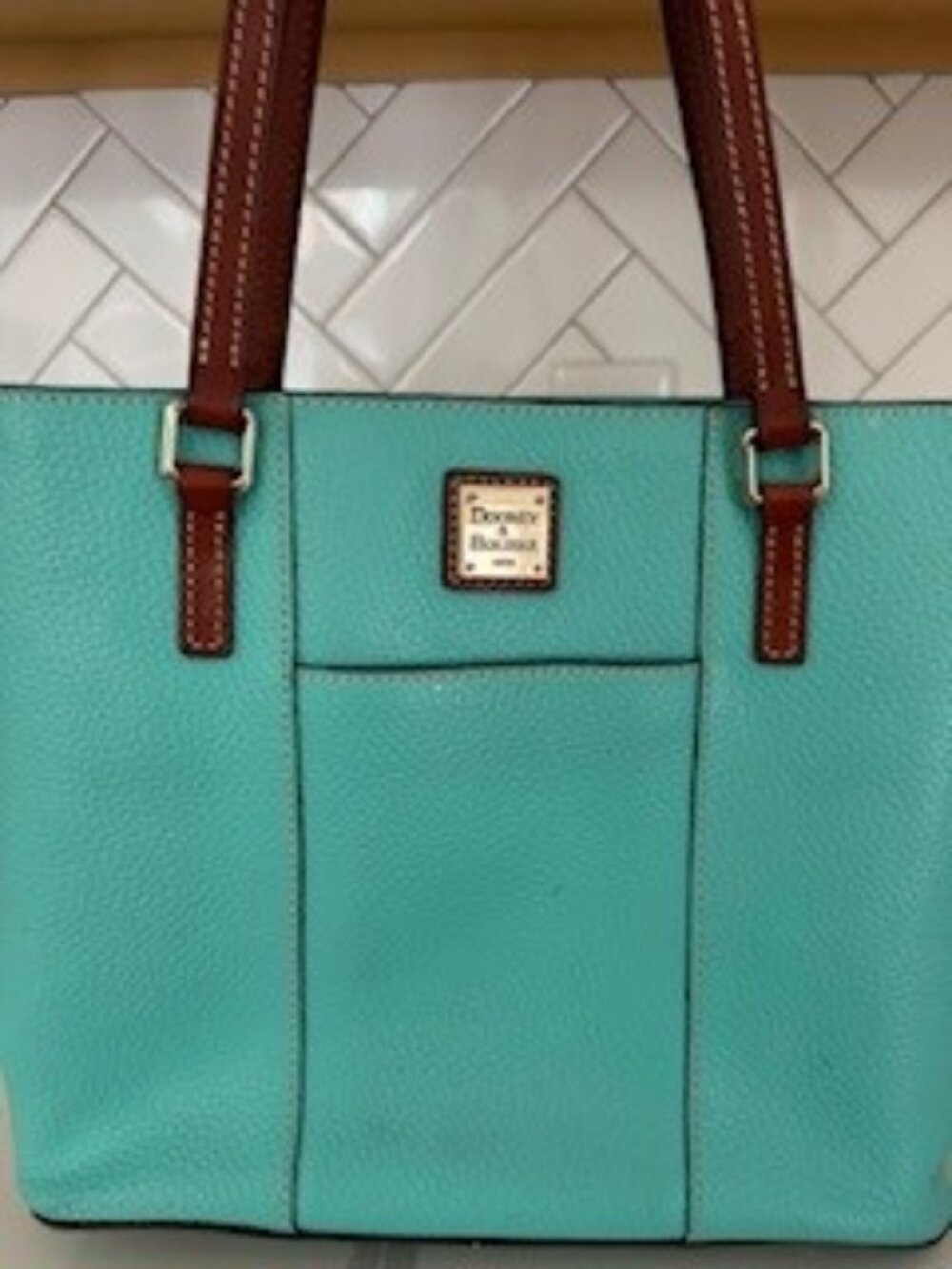 Dooney & Bourke Pebble Grain Small Lexington tote bag in a vibrant teal